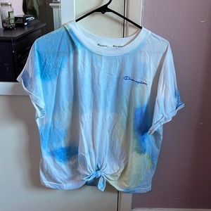 White and blue champion shirt that has a tie in the front.